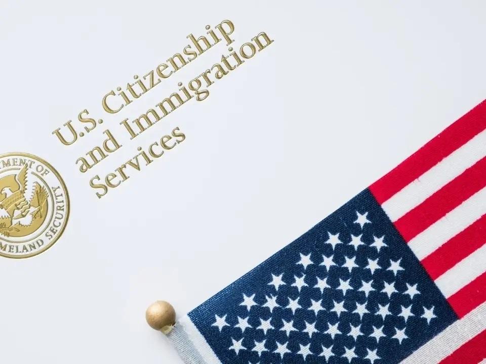 US flag and the words US Citizenship and Immigration services
